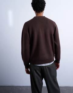 Model wearing Relaxed fit knitted crew neck jumper in brown