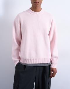 Model wearing Relaxed fit knitted crew neck jumper in pink