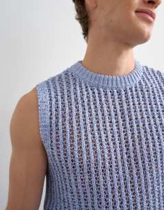 Model wearing Relaxed fit knitted crochet tank in blue
