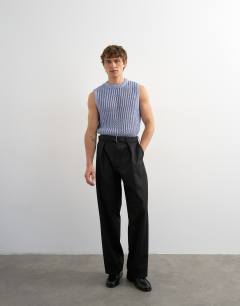 Model wearing Relaxed fit knitted crochet tank in blue