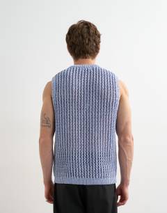 Model wearing Relaxed fit knitted crochet tank in blue