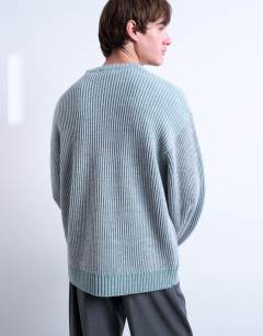 Model wearing Relaxed fit knitted fisherman jumper in washed blue