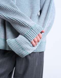 Model wearing Relaxed fit knitted fisherman jumper in washed blue