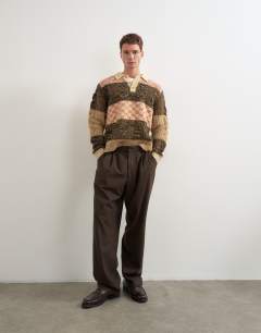 Model wearing Relaxed fit knitted polo with patchwork design in brown