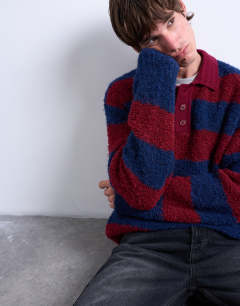 Model wearing Relaxed fit knitted stripe polo jumper in burgundy