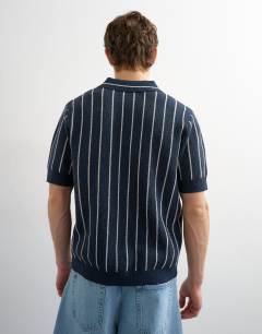 Model wearing Relaxed fit knitted stripe polo with east side jacquard in navy