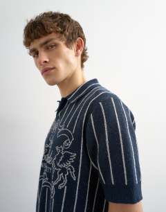 Model wearing Relaxed fit knitted stripe polo with east side jacquard in navy