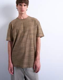 Model wearing Relaxed fit knitted stripe t-shirt in brown