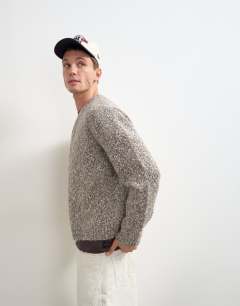 Model wearing Relaxed fit knitted twist cardigan with notch neck in light taupe
