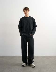 Model wearing Relaxed fit layered t-shirt with waffle sleeve in washed black