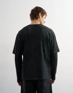 Model wearing Relaxed fit layered t-shirt with waffle sleeve in washed black