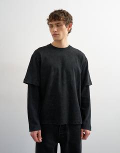 Model wearing Relaxed fit layered t-shirt with waffle sleeve in washed black