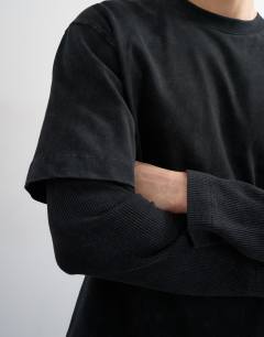Model wearing Relaxed fit layered t-shirt with waffle sleeve in washed black