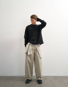 Model wearing Relaxed fit layered t-shirt with waffle sleeve in washed black
