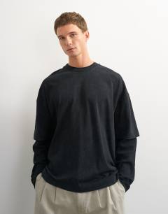 Model wearing Relaxed fit layered t-shirt with waffle sleeve in washed black