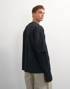 Model wearing Relaxed fit layered t-shirt with waffle sleeve in washed black