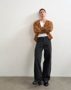 Model wearing Relaxed fit leapord print knitted cardigan in tan