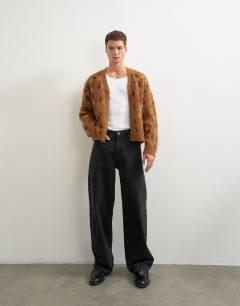 Model wearing Relaxed fit leapord print knitted cardigan in tan