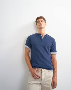 Model wearing Relaxed fit linen mix henley t-shirt in navy