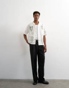 Model wearing Relaxed fit linen mix shirt with all over placement embroidery in ecru