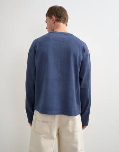 Model wearing Relaxed fit long sleeve heavyweight t-shirt in washed navy