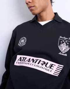 Model wearing Relaxed fit long sleeve sports polo shirt with Marseille back embroidery in black 