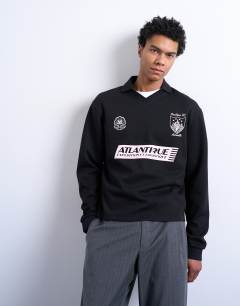 Model wearing Relaxed fit long sleeve sports polo shirt with Marseille back embroidery in black 