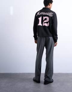 Model wearing Relaxed fit long sleeve sports polo shirt with Marseille back embroidery in black 