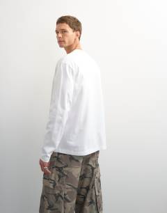 Model wearing Relaxed fit long sleeve t-shirt in white