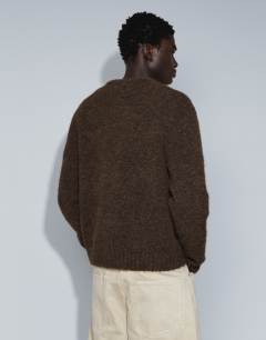 Model wearing Relaxed fit loose knit jumper in brown