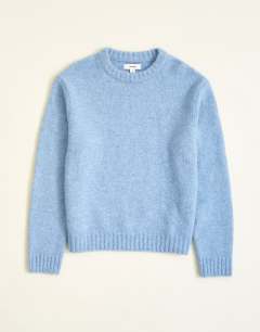 Model wearing Relaxed fit loose knit jumper in light blue