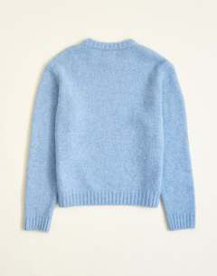 Model wearing Relaxed fit loose knit jumper in light blue