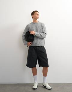 Model wearing Relaxed fit loose knit jumper in light grey