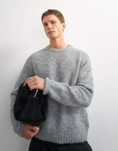 Model wearing Relaxed fit loose knit jumper in light grey