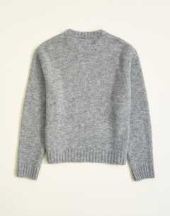 Model wearing Relaxed fit loose knit jumper in light grey