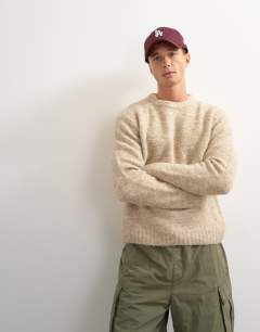 Model wearing Relaxed fit loose knit jumper in stone