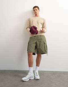 Model wearing Relaxed fit loose knit jumper in stone