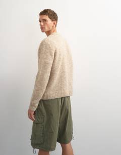 Model wearing Relaxed fit loose knit jumper in stone