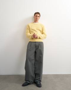 Model wearing Relaxed fit loose knit jumper in yellow