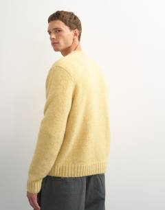 Model wearing Relaxed fit loose knit jumper in yellow