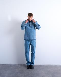 Model wearing Relaxed fit overhead denim shirt in mid wash