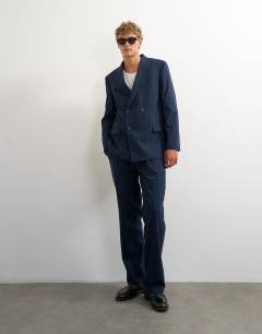 Model wearing Relaxed fit pinstripe double breasted blazer in navy