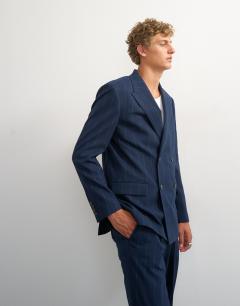 Model wearing Relaxed fit pinstripe double breasted blazer in navy