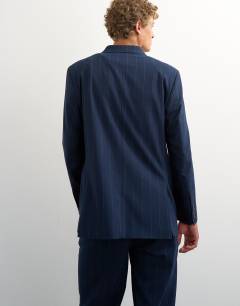 Model wearing Relaxed fit pinstripe double breasted blazer in navy