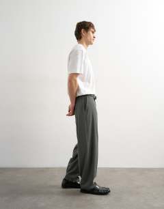 Model wearing Relaxed fit pinstripe trouser in charcoal