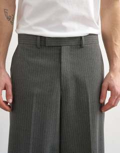 Model wearing Relaxed fit pinstripe trouser in charcoal