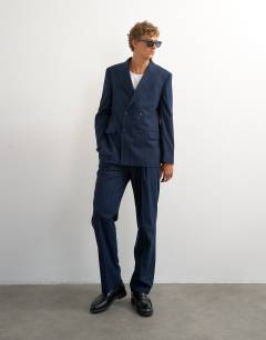 Model wearing Relaxed fit pinstripe trousers in navy