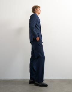 Model wearing Relaxed fit pinstripe trousers in navy