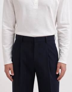 Model wearing Relaxed fit pinstripe trousers in navy