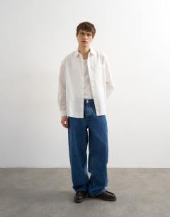 Model wearing Relaxed fit poplin shirt in white